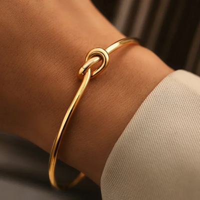 14K Gold Knotted Bangle That Symbolises Love & Draws Compliments