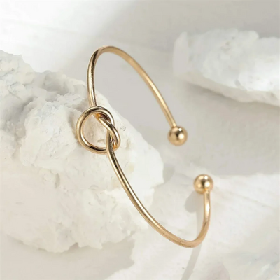 14K Gold Knotted Bangle That Symbolises Love & Draws Compliments